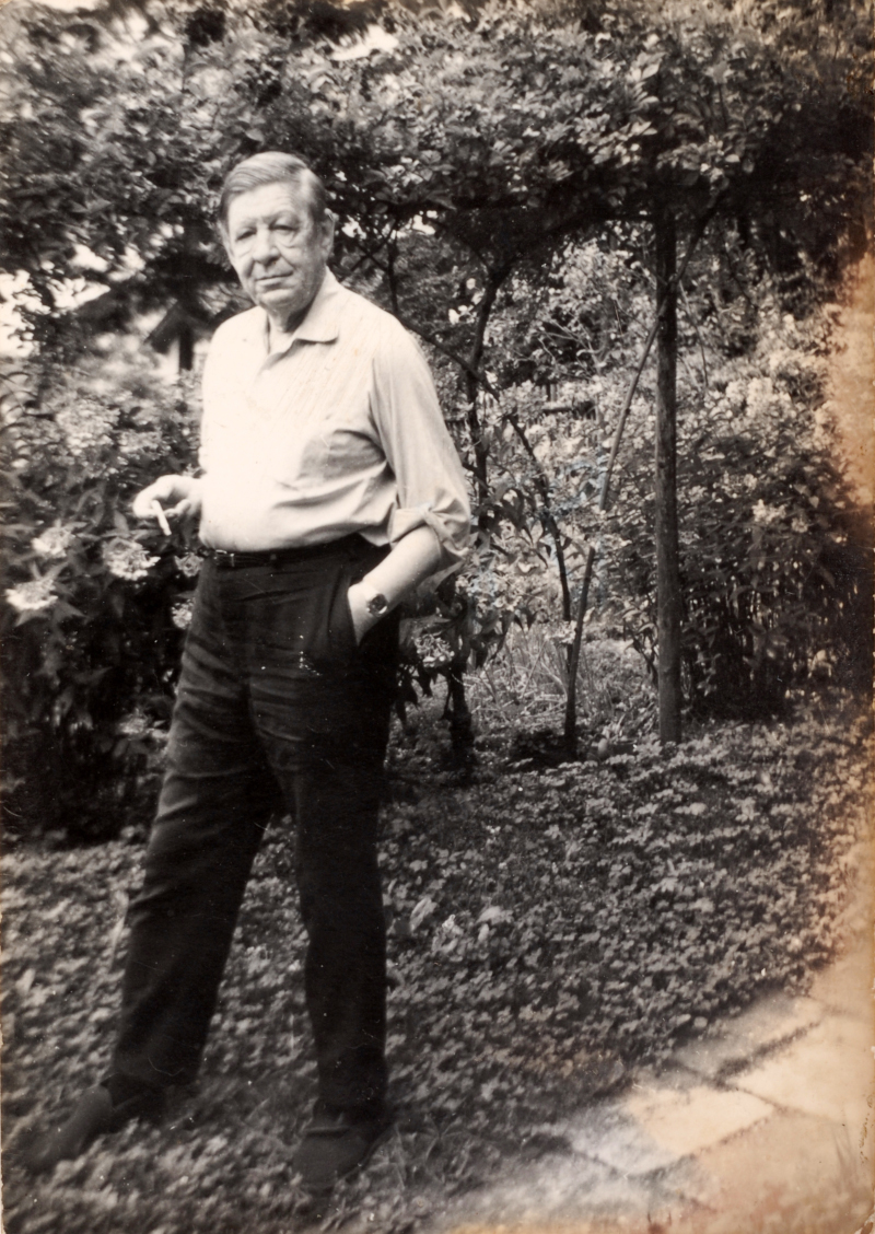 W. H. Auden standing in the garden of his house in Kirchstetten.